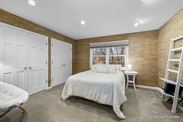 carpeted bedroom with baseboards, recessed lighting, and multiple closets