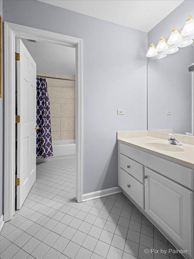 full bath featuring shower / bath combination with curtain, tile patterned flooring, vanity, and baseboards