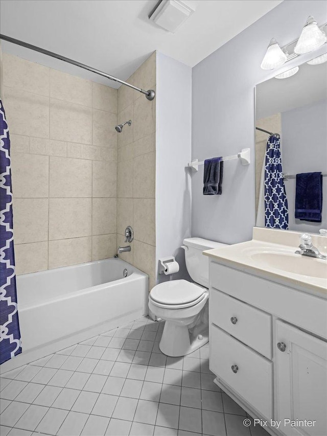 full bathroom featuring visible vents, toilet, shower / bath combo, vanity, and tile patterned flooring