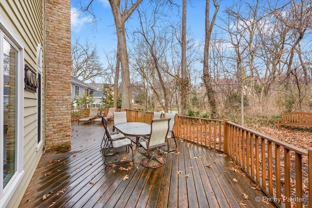 deck with outdoor dining area