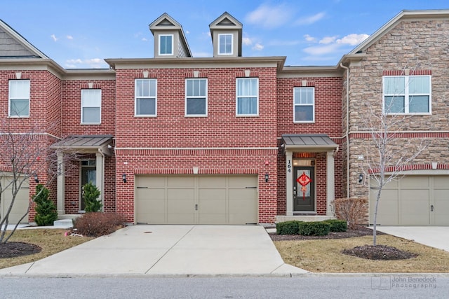 multi unit property featuring a garage