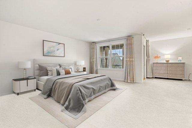 bedroom featuring light colored carpet