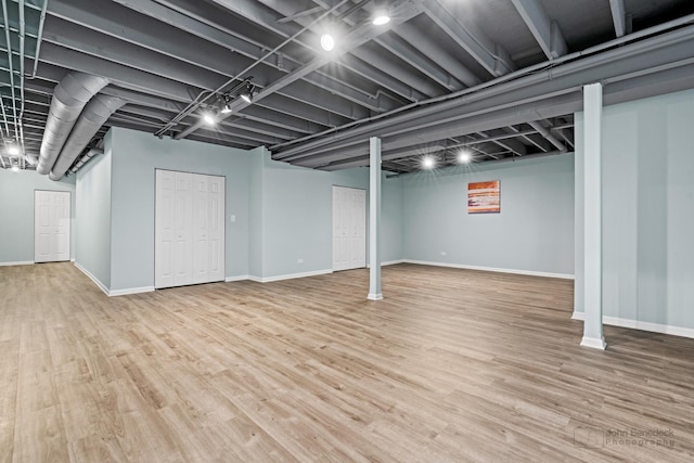 basement featuring hardwood / wood-style flooring