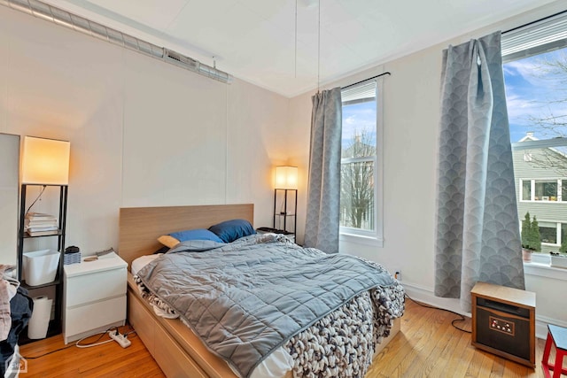 bedroom with light hardwood / wood-style floors