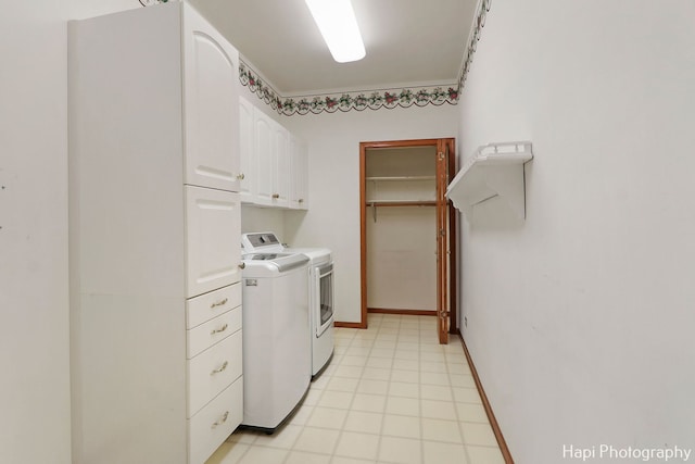 laundry area featuring cabinets and separate washer and dryer