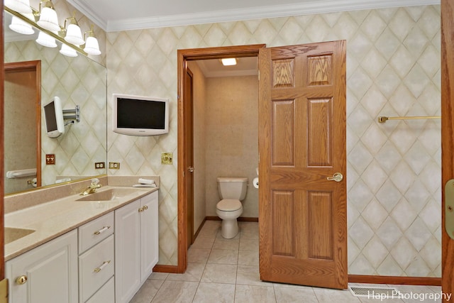 bathroom featuring crown molding, tile patterned flooring, an inviting chandelier, vanity, and toilet