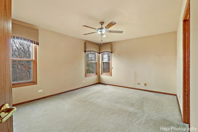 unfurnished room featuring carpet floors and ceiling fan