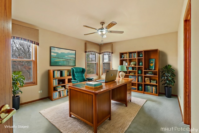 carpeted office with ceiling fan