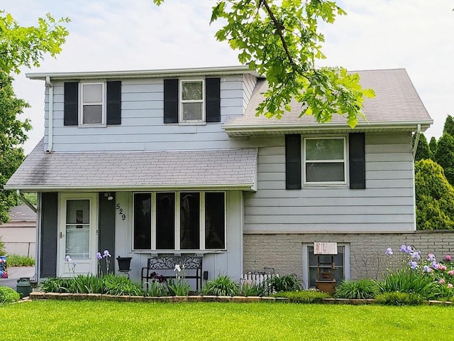 split level home with a front yard