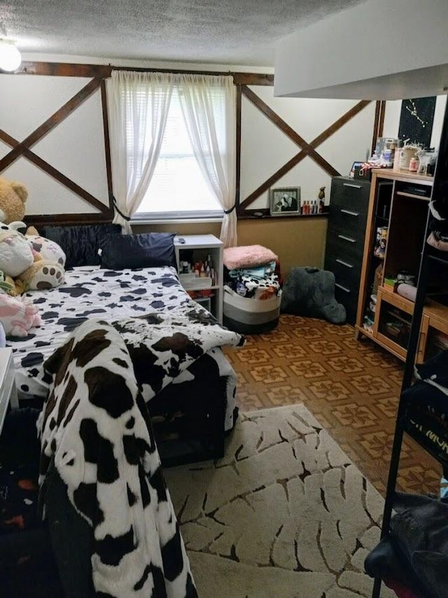 bedroom featuring a textured ceiling