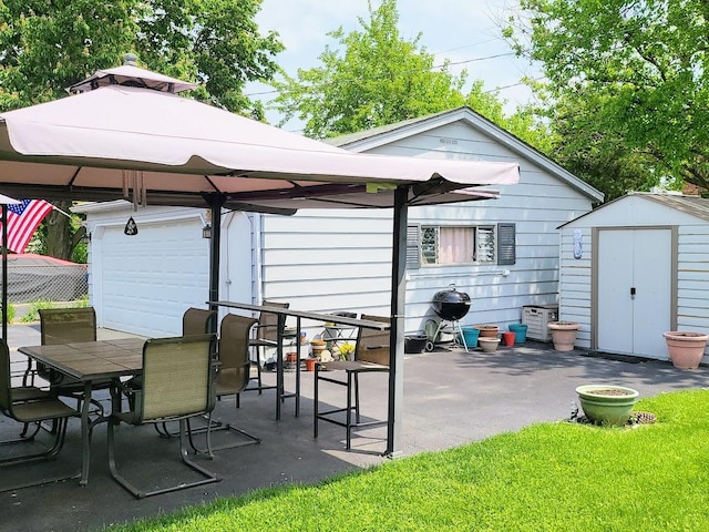 view of patio with a gazebo and a storage shed