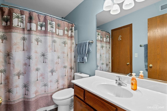 bathroom featuring visible vents, curtained shower, toilet, and vanity