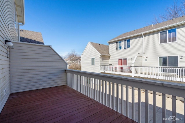 wooden terrace with a residential view