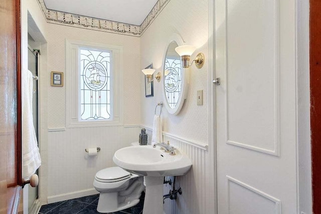 bathroom featuring tile patterned floors and toilet