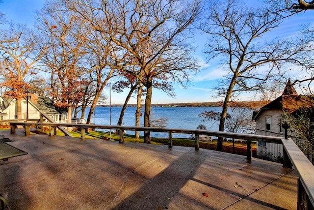 deck featuring a water view