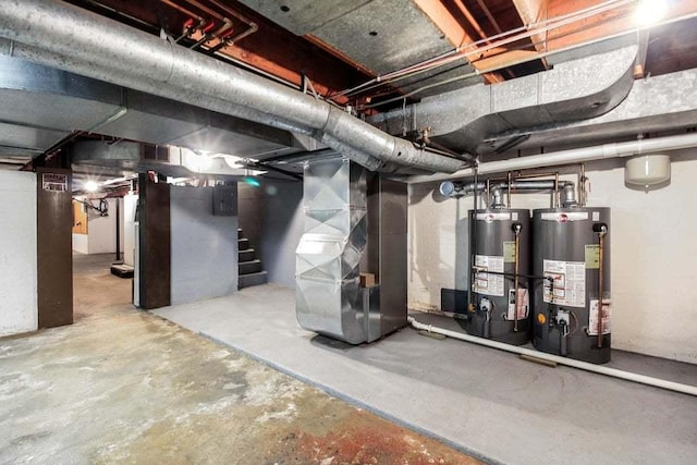 basement featuring heating unit and water heater