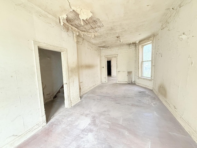 7243 S Perry Ave, Chicago, IL 60621 - unfurnished room with radiator and unfinished concrete flooring