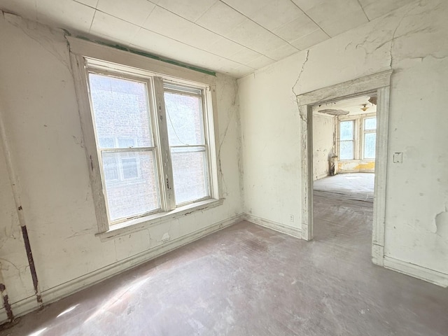 7243 S Perry Ave, Chicago, IL 60621 - spare room with healthy amount of natural light and concrete floors