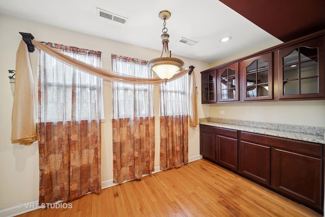 unfurnished dining area featuring visible vents, recessed lighting, light wood-type flooring, and baseboards