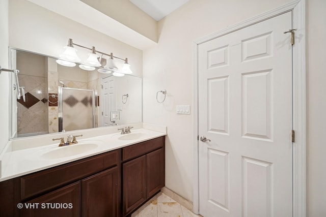 full bathroom featuring a sink, a stall shower, and double vanity