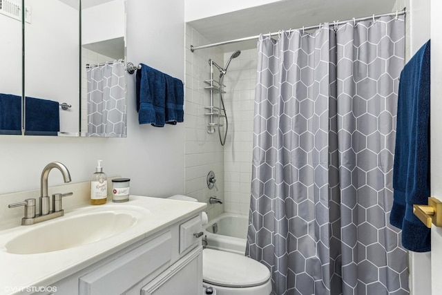 bathroom featuring toilet, visible vents, shower / bath combo with shower curtain, and vanity