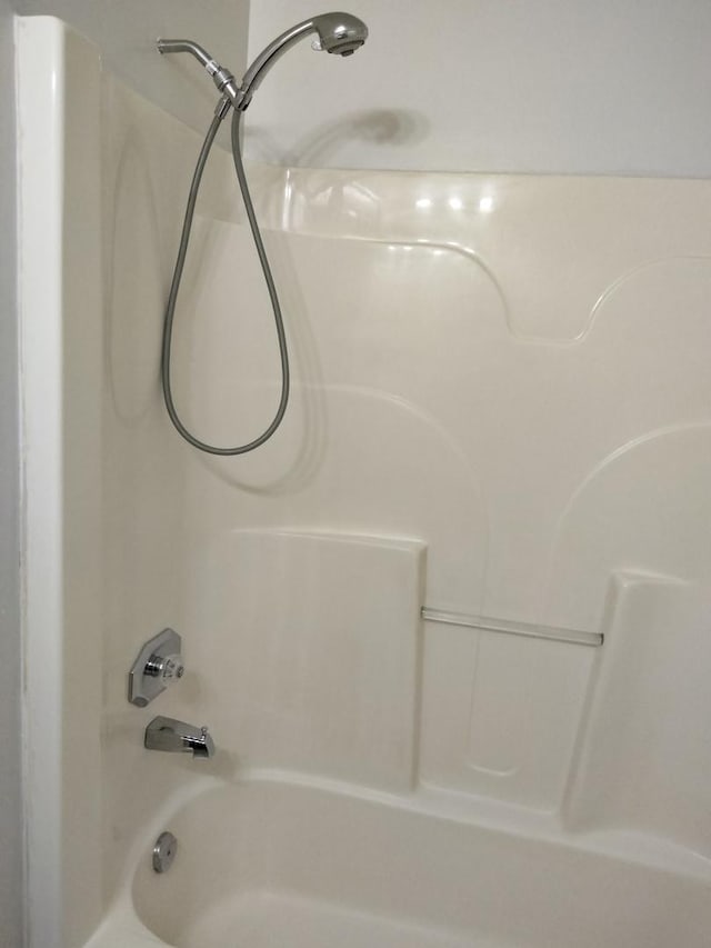 bathroom with shower / bathing tub combination