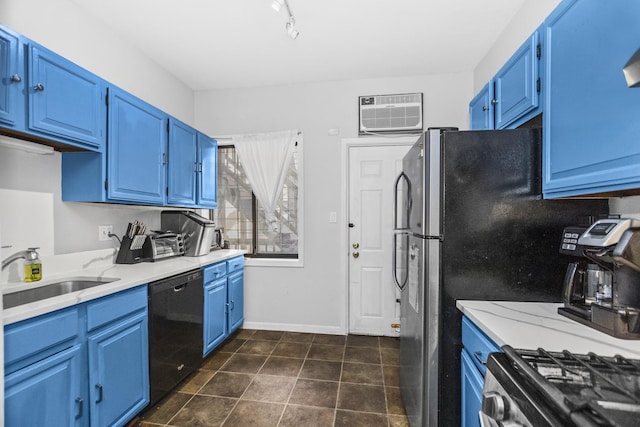 kitchen featuring blue cabinets, black dishwasher, sink, and a wall mounted air conditioner