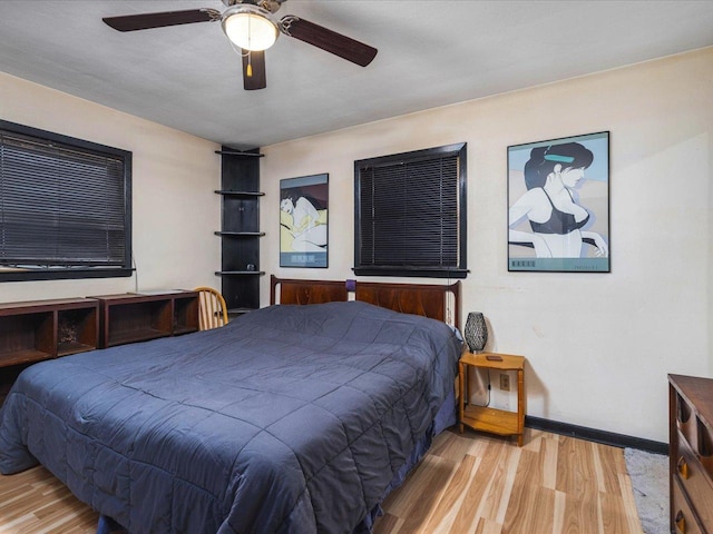 bedroom featuring ceiling fan and light hardwood / wood-style flooring