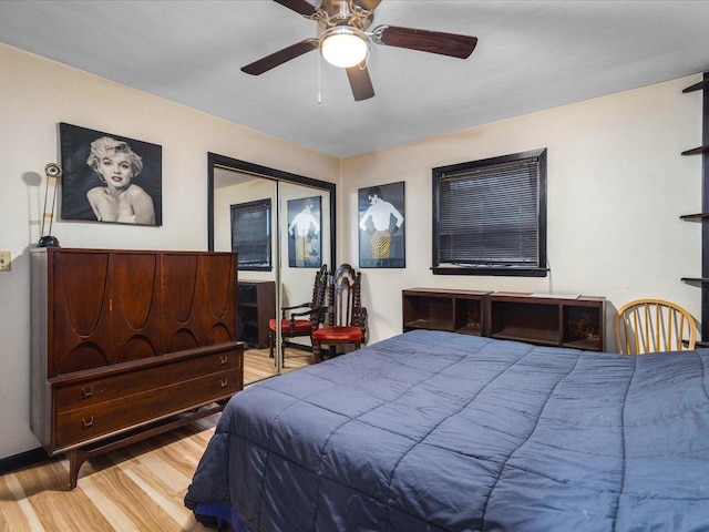 bedroom featuring light hardwood / wood-style floors and ceiling fan