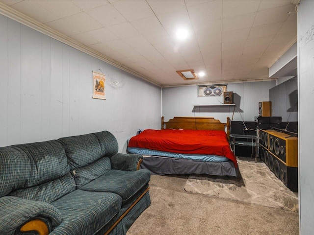 bedroom with ornamental molding and carpet flooring