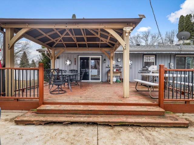 wooden terrace featuring a gazebo