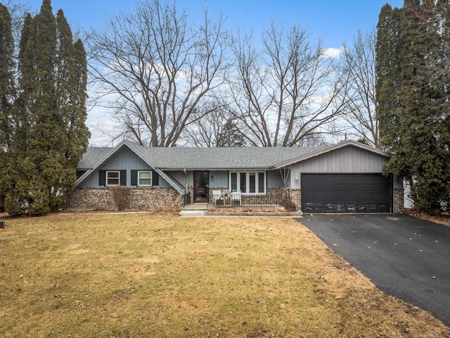 view of front of property featuring a garage and a front yard