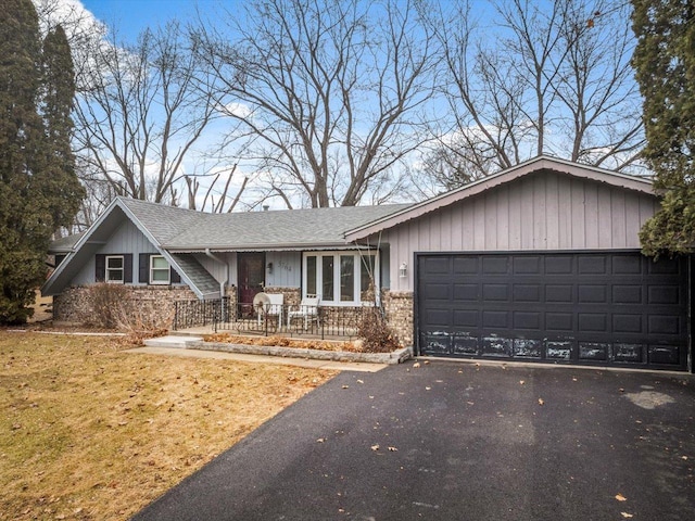 ranch-style house featuring a garage