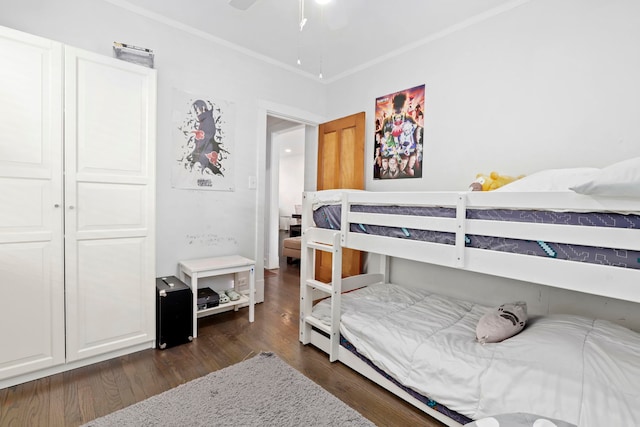 bedroom featuring ornamental molding and dark hardwood / wood-style floors