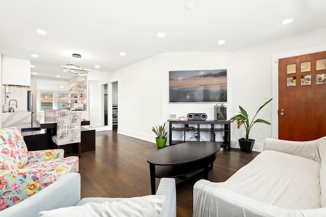 living room with sink and dark hardwood / wood-style floors