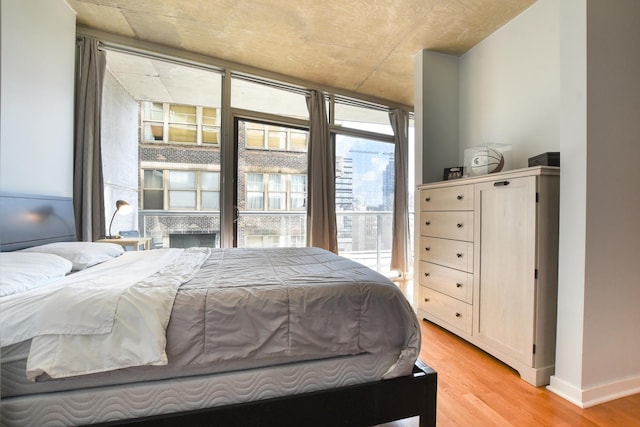 bedroom with light hardwood / wood-style floors