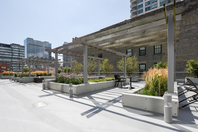 view of community with a pergola and a patio area