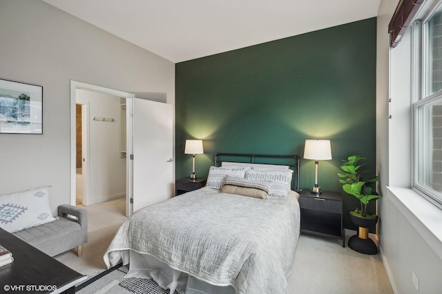 bedroom featuring light colored carpet