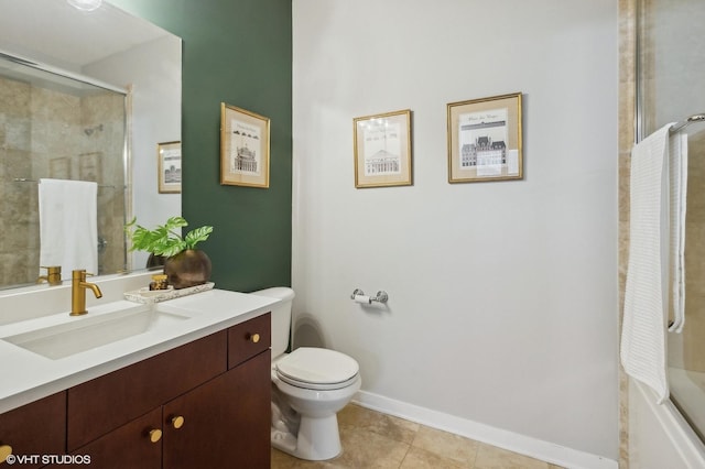 bathroom featuring vanity, tile patterned floors, and toilet