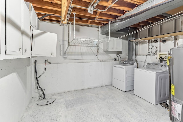 basement featuring washer and clothes dryer and gas water heater