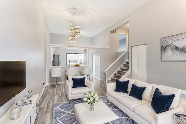 living room with light hardwood / wood-style flooring