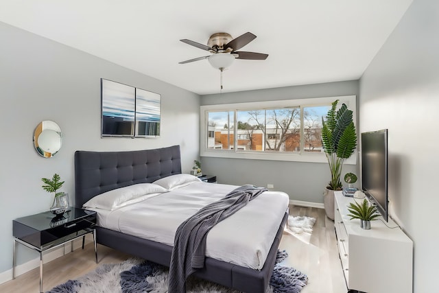 bedroom featuring ceiling fan and light hardwood / wood-style flooring