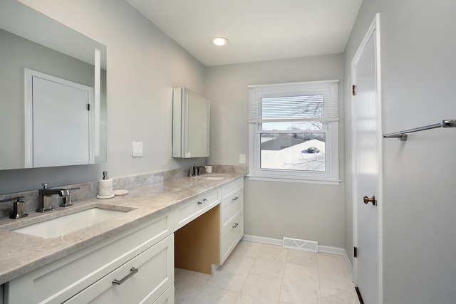 bathroom with vanity and tile patterned floors