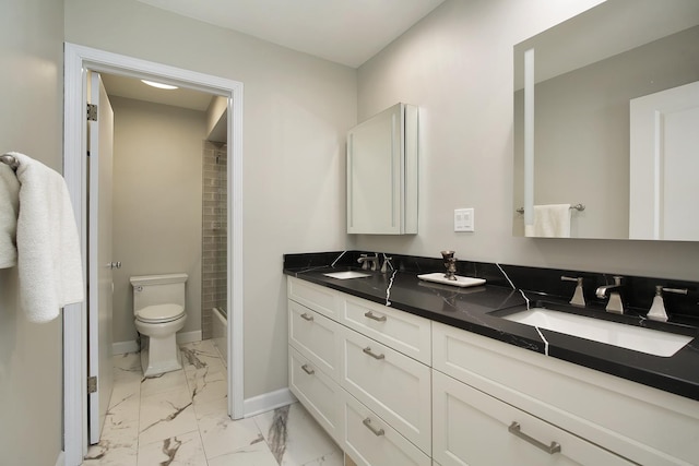 full bathroom with vanity, toilet, and washtub / shower combination