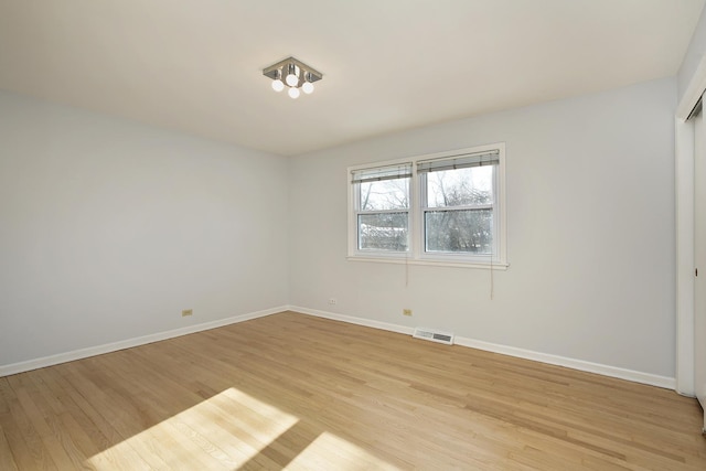 empty room with light wood-type flooring