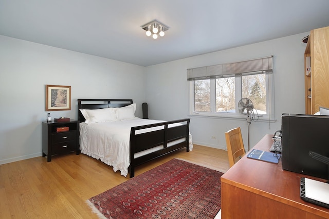 bedroom with light hardwood / wood-style flooring