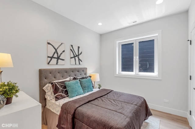 bedroom with light hardwood / wood-style flooring