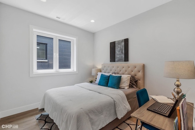 bedroom featuring hardwood / wood-style floors