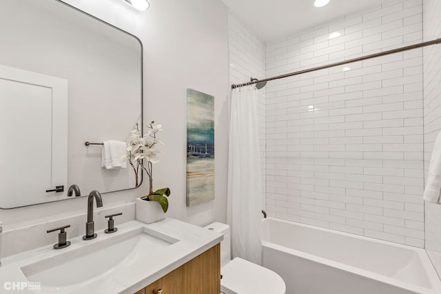 full bathroom featuring vanity, shower / tub combo, and toilet