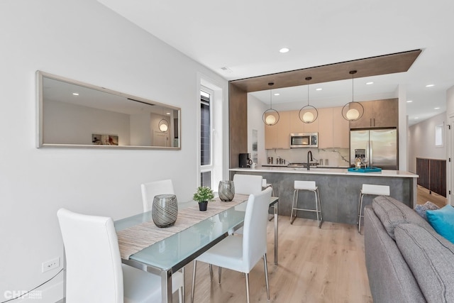 dining space featuring light hardwood / wood-style floors